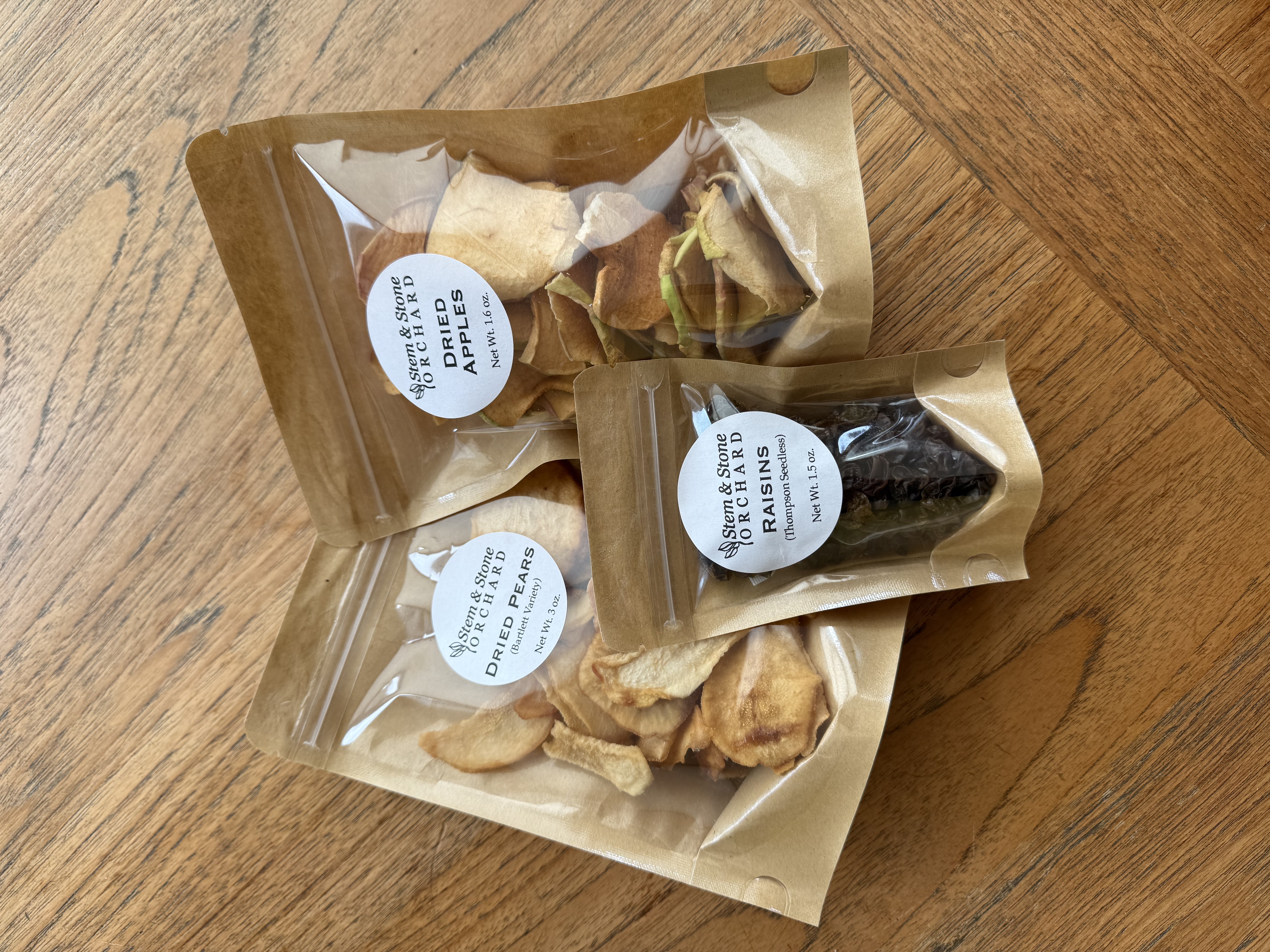 Bags of dried apples, pears, and Raisins from Stem & Stone Orchard