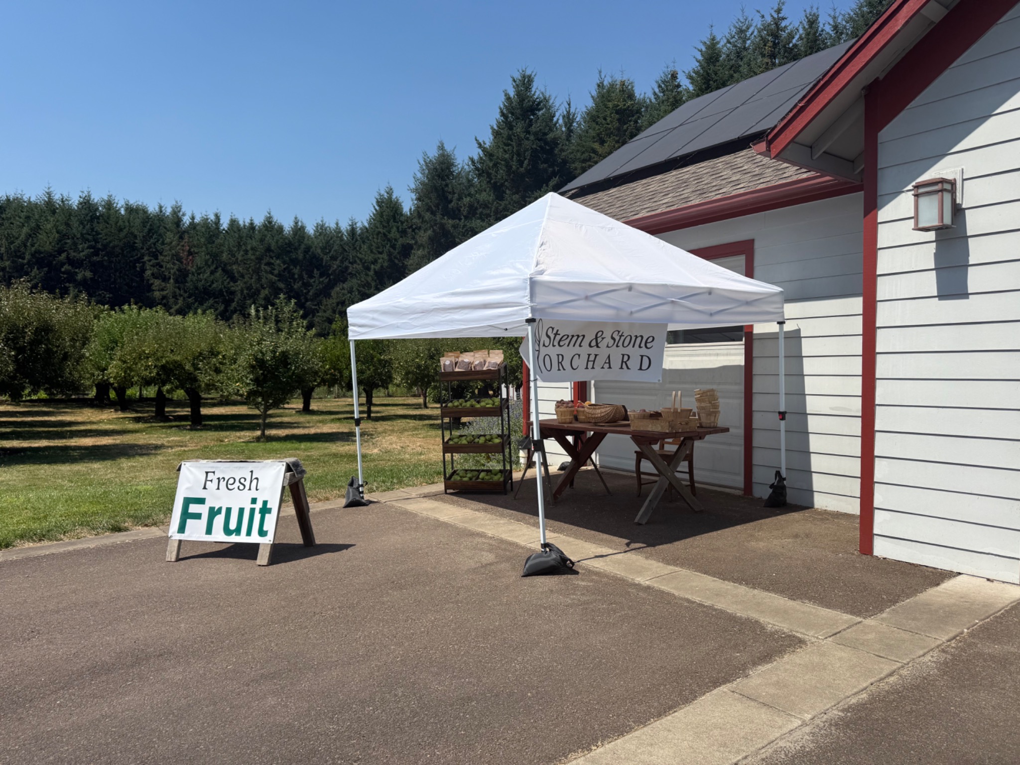 The Stem & Stone Orchard fruit stand beside the orchard